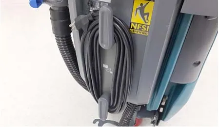 Photo of the charger power cord wrapped around the cord hooks