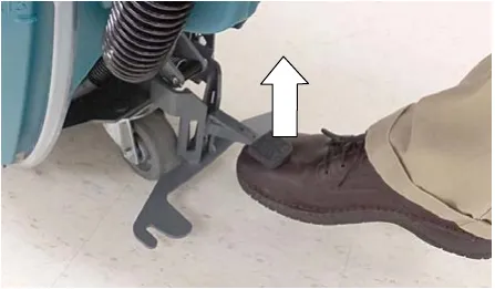 Photo of a foot lifting the squeegee mount bracket pedal