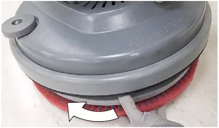 Photo of the single disk pad driver being turned to remove it
