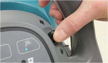 Photo of a hand pushing the directional lever on the control handle