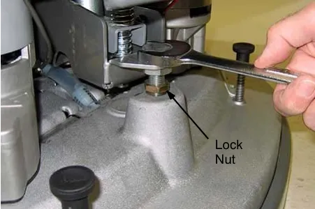 Wrench on the leveling screw lock nut of the scrub head