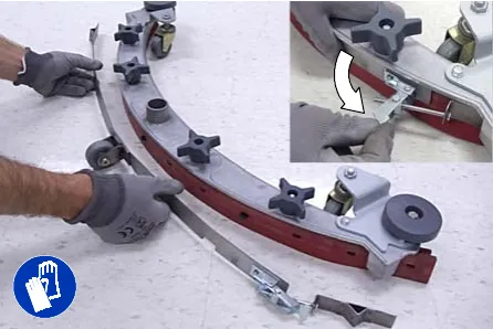 Loosening the band clamp and removing the band from the squeegee assembly