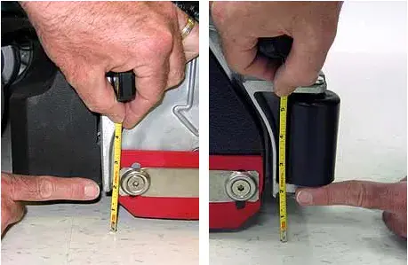 Measuring from the front edge and from the back edge of the scrub head to the floor with a tape measure