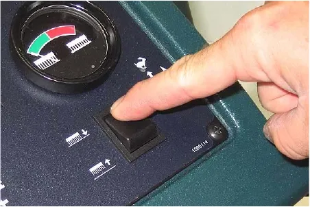 Pressing the brush pressure button to lower the scrub head