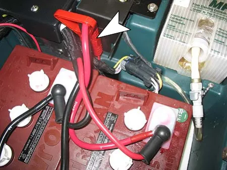 Red handle battery connector harness attached to the battery charger connector