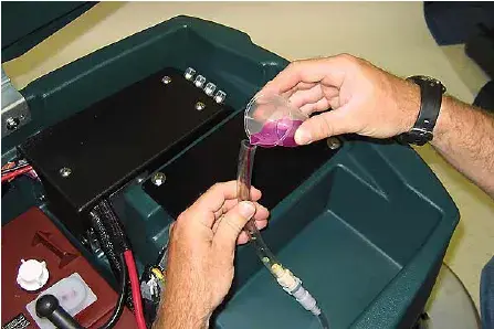 Pouring antifreeze into the FaST supply hose