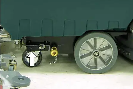 Designated jacking location at the rear of the machine marked by an arrow