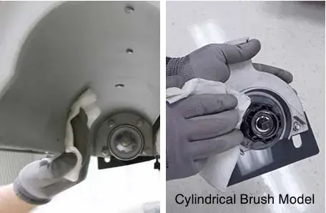 Wiping debris from the idler plate and drive hub, cylindrical brush model