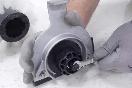 Turning the brush plug shaft with a wrench
