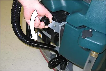 Lowering the squeegee lift lever to put the squeegee on the floor