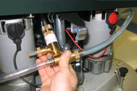 Removing the injector assembly from its clamps