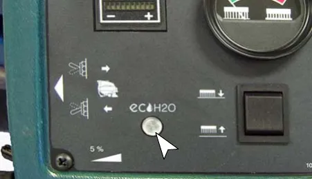 Control panel with the ec-H2O system indicator light marked by an arrow