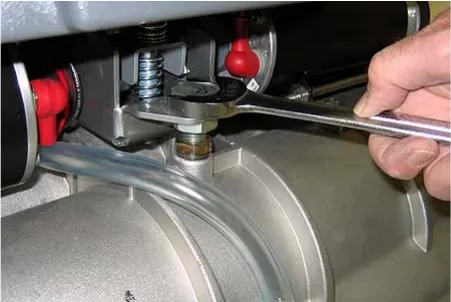 Wrench on the leveling screw lock nut