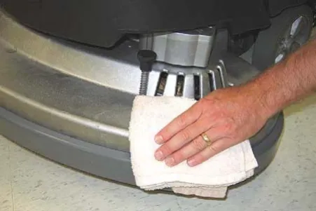 Wiping the machine with a damp cloth