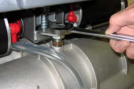 Wrench on the lock nut of the leveling screw on the cylindrical brush scrub head