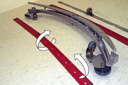 Front squeegee blade removed after loosening the four knobs and rotated to a new wiping edge