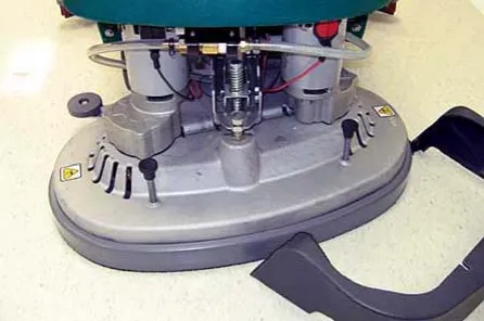 Scrub head lowered with the front shroud removed to reach the detergent injector assembly