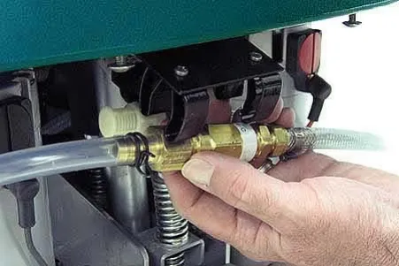 Injector assembly being removed from its clamps