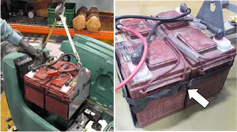 Battery pack being lifted with a strap and hoist, and a close view of the battery strap securing the batteries to the tray