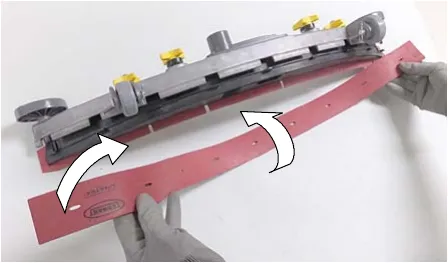 Rear squeegee blade being rotated to a new wiping edge, arrows showing the rotation