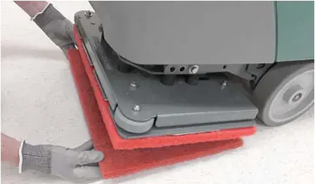 Work pad being attached to the backer pad on the orbital scrub head