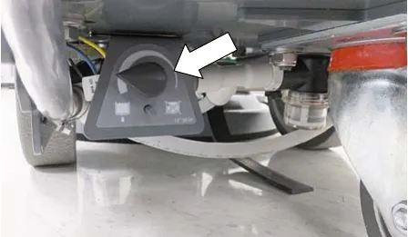 Solution flow control knob under the machine, arrow showing the knob