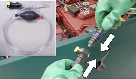 Hand pump hose and the battery fill hose coupler being connected, arrows showing the connection
