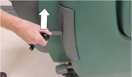 Hand lifting the down pressure lever on the side of the machine, arrow showing the lift