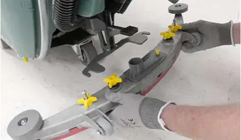 Squeegee assembly being mounted on the squeegee mount bracket, knobs to be tightened