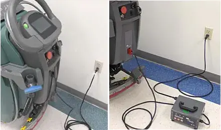 Machine plugged into an off-board battery charger at a wall outlet
