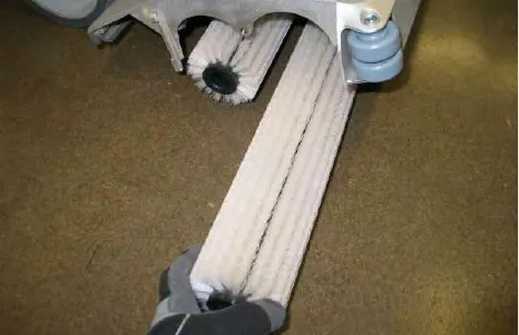Pulling a cylindrical scrub brush out of the scrub head