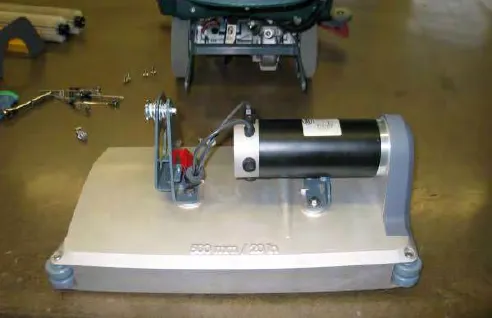 Scrub head assembly with its motor, removed and set on the floor