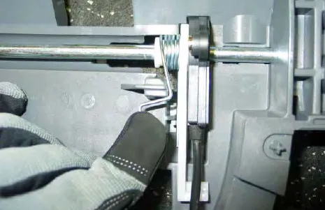 Releasing the spring on the bail switch mechanism with a gloved finger