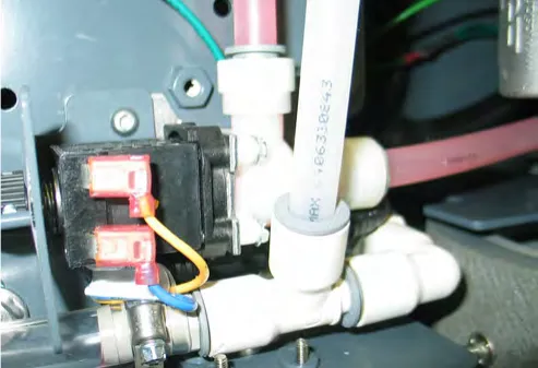Water solenoid with its two PTC fittings and electrical connectors