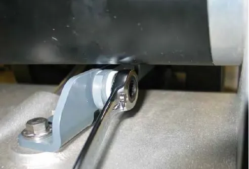 Wrench on the second lift mechanism mounting bolt