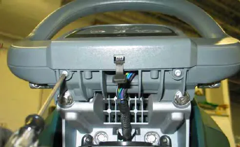 Removing a torx screw from the back of the operator console