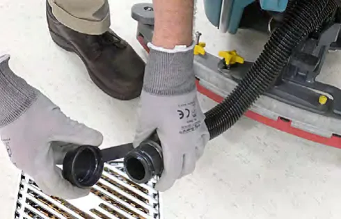 Draining the solution and recovery tanks over a floor drain