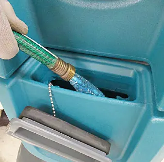 A hose filling the solution tank