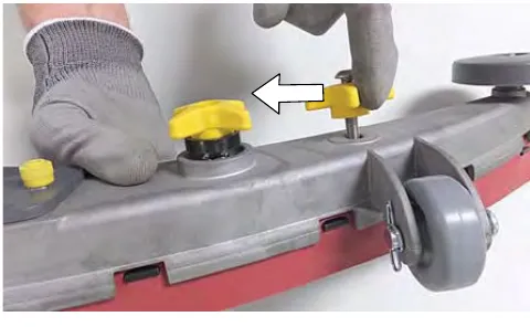 Re-tightening the two outside knobs while squeezing the squeegee frame and blade retainer together