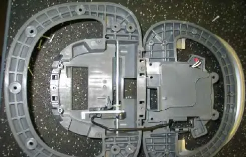 Operator’s console separated into two halves, showing the bail switch mechanism inside