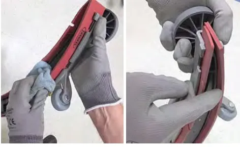 Wiping the squeegee blades clean and checking them for wear and damage