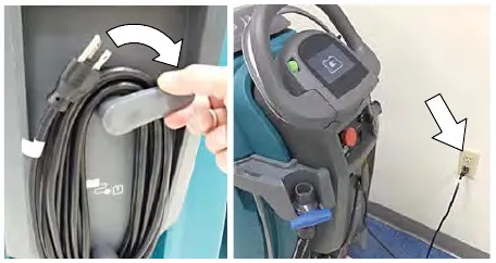 Unhooking the charger power cord from the storage hooks and plugging it into a wall outlet