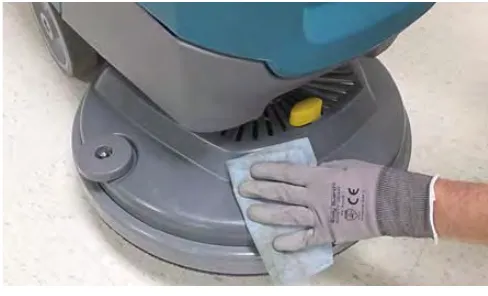 Wiping the outside of the machine with a damp cloth