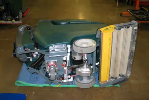 Machine lowered onto its left side on a blanket