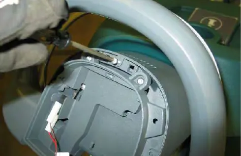Removing a torx screw inside the console cover