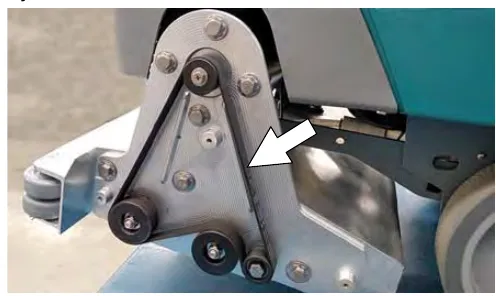 Cylindrical brush drive belt on the side of the cylindrical scrub head, with an arrow pointing to the belt