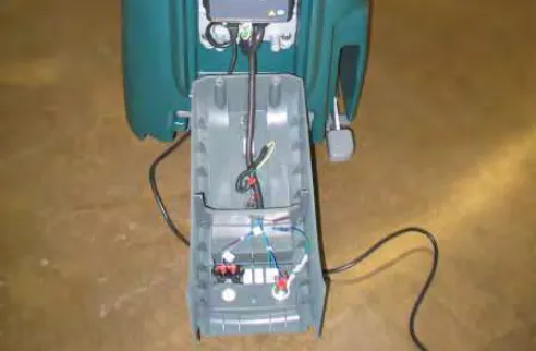 Access cover lowered to the floor, hanging from its cable