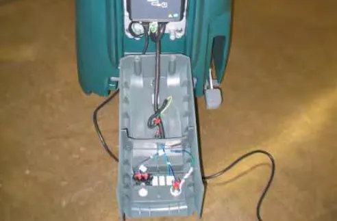Access cover lowered to the floor, hanging from its cable