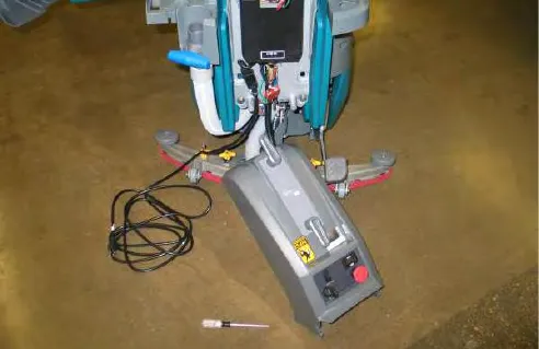 Access cover lowered to the floor, hanging from its cable