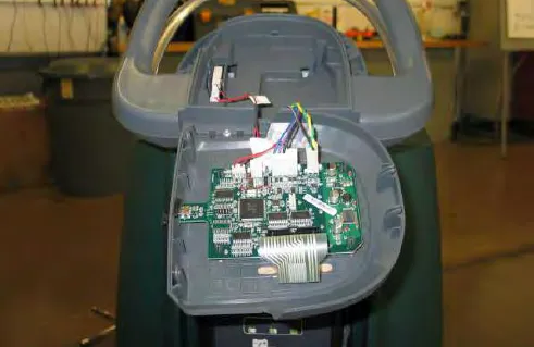 Touch panel separated from the console, showing the circuit board and wiring
